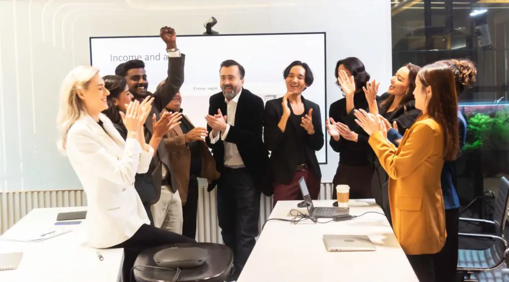 Team celebrating in a conference room.